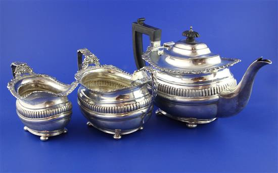 An Edwardian three piece silver tea set, gross 37.5 oz.